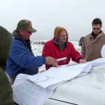 Dairy farm engineers work in the office and on site